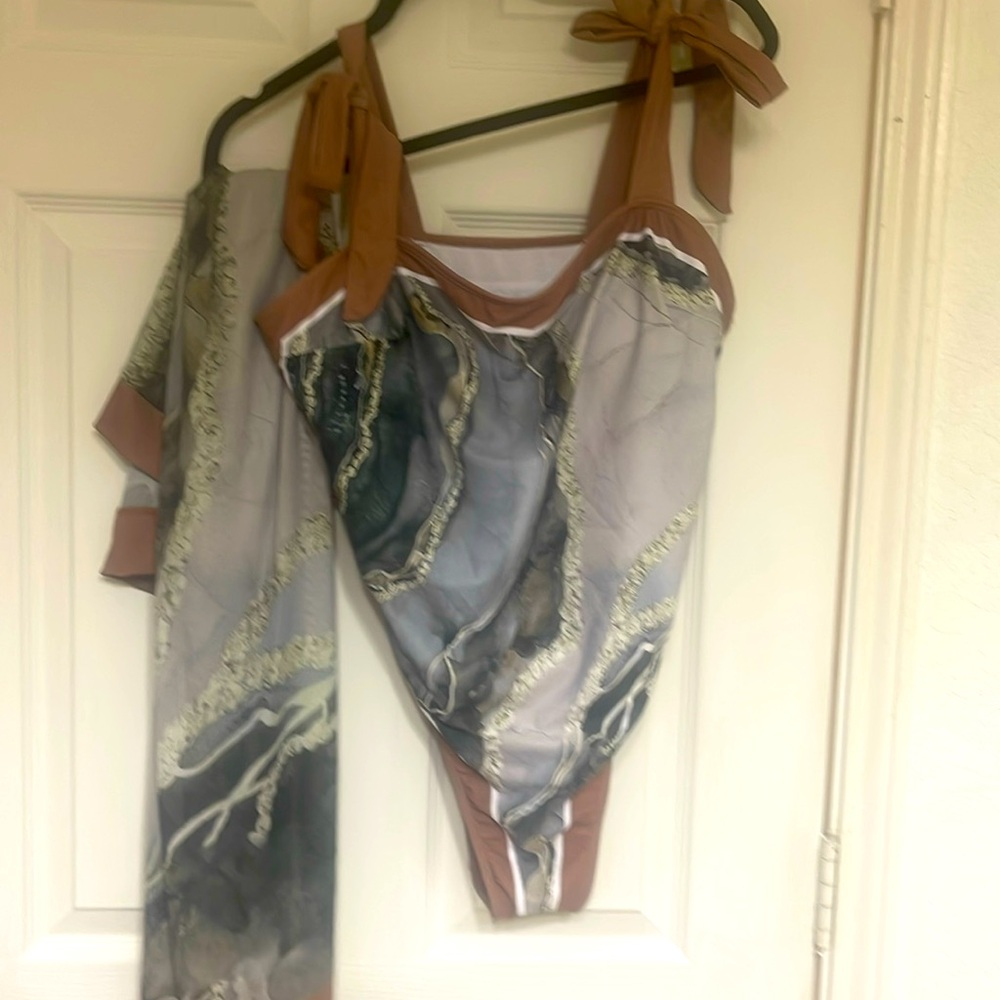 One piece swimsuit with matching coverup skirt
